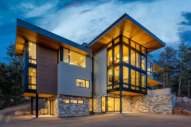 Example of a large minimalist exterior home design in Denver