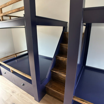 Spacious Shared Kids Room with Custom Bunk Beds, Integrated Drawers, and Vaulted