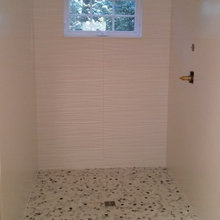 pebble shower with drop down bench