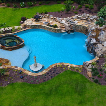 Natural freeform pool with Cave and Beach entry