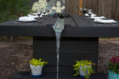 Inspiration for a small modern partial sun backyard gravel water fountain landscape in DC Metro.