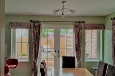 Roman blinds and matching curtains on poles