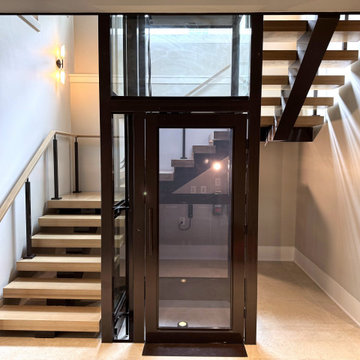 Project #136 | Modern Floating Staircase Encircling Glass Elevator