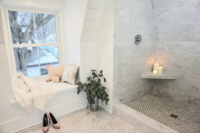 Inspiration for a mid-sized scandinavian master bathroom in Charleston with shaker cabinets, grey cabinets, a drop-in tub, a double shower, a one-piece toilet, white tile, marble, white walls, marble floors, an undermount sink, marble benchtops, white floor, a sliding shower screen and grey benchtops.