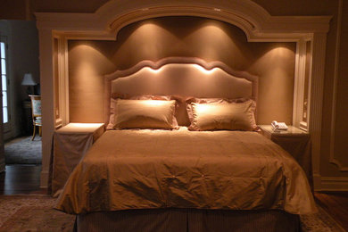 Inspiration for a timeless master bedroom remodel in New York with a two-sided fireplace