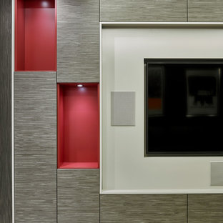 Design ideas for a medium sized contemporary enclosed home cinema in London with red walls, carpet and a built-in media unit.