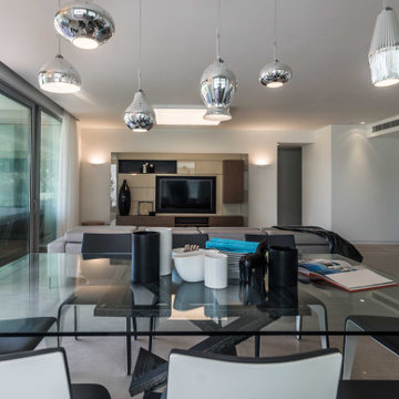 Dining area with silver pendants
