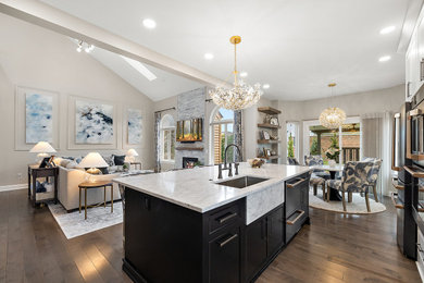 Eat-in kitchen - large transitional l-shaped dark wood floor and brown floor eat-in kitchen idea in Detroit with an undermount sink, shaker cabinets, white cabinets, quartz countertops, white backsplash, quartz backsplash, black appliances, an island and white countertops
