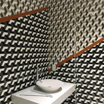 Modern bathroom with grey toned glass mosaic walls