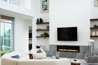Trendy open concept light wood floor and beige floor living room photo in Austin with white walls, a ribbon fireplace and a stone fireplace