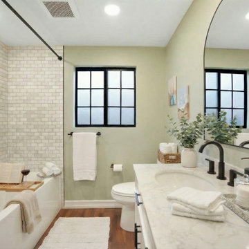 Irvine Bathroom Remodel with White Double Vanity, Arched Mirrors & Black Fixture