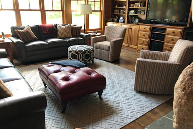 Example of a large mountain style open concept living room design in Other
