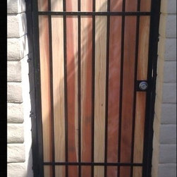Black Iron Gate with Redwood - Home Fencing And Gates