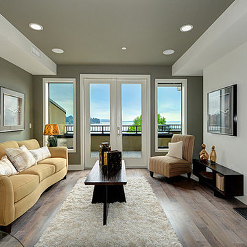 Living Room with Fireplace and Balcony to enjoy the Water and Mountains
