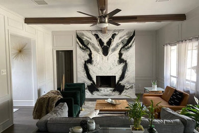 Mid-sized minimalist living room photo in Dallas with a hanging fireplace and a stone fireplace