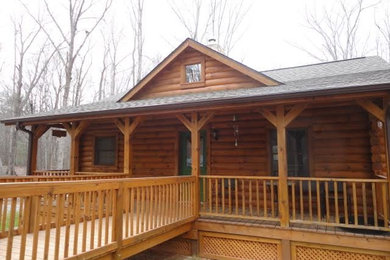 Example of a small mountain style brown one-story wood gable roof design in Raleigh