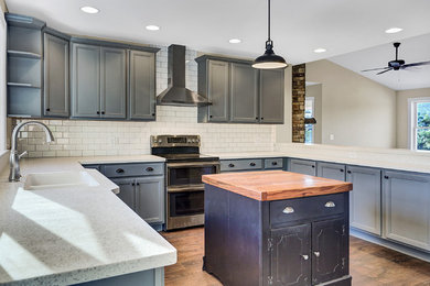 Minimalist kitchen photo in Other with an island