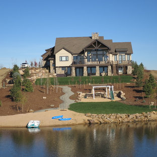 Inspiration for an expansive traditional backyard full sun garden in Denver with with outdoor playset and mulch.
