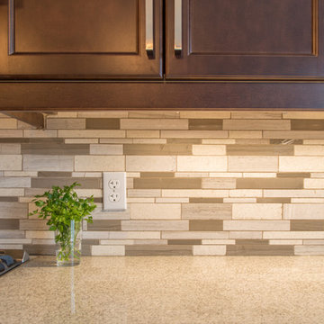 Falsetta - Brown Cabinets with Mosaic Tile Backsplash