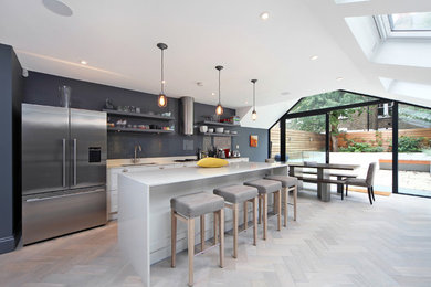 Design ideas for a large contemporary eat-in kitchen in London with an undermount sink, granite benchtops, grey splashback, stainless steel appliances, light hardwood floors, with island, open cabinets, grey cabinets and glass sheet splashback.