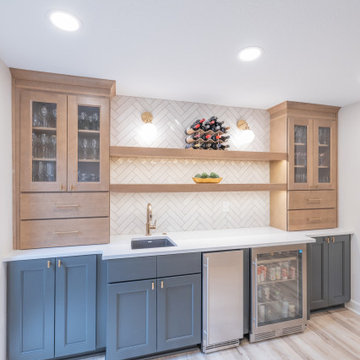Warm & Inviting Basement Retreat with Custom Bar + Entertainment Center
