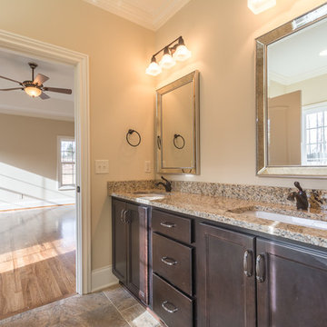 Warm tones connect with wood floors in adjacent bedroom