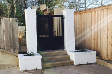 Photo of a large traditional partial sun front yard landscaping in Dallas.