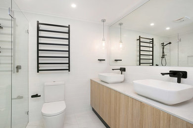 Inspiration for a mid-sized contemporary bathroom in Sydney.