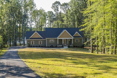 Large elegant green two-story concrete fiberboard exterior home photo in Richmond with a shingle roof
