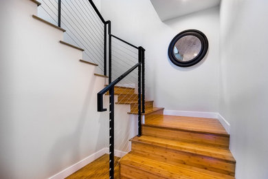 Staircase - contemporary metal l-shaped staircase idea in Los Angeles with metal risers