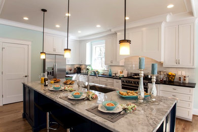 Large elegant l-shaped light wood floor open concept kitchen photo in Baltimore with a single-bowl sink, shaker cabinets, white cabinets, stainless steel appliances, an island, marble countertops, white backsplash and glass tile backsplash