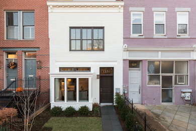 Contemporary white brick townhouse exterior idea in DC Metro