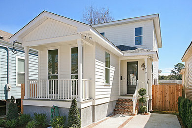 Inspiration for a timeless white two-story exterior home remodel in New Orleans