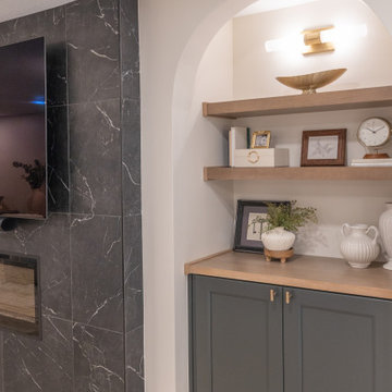 Warm & Inviting Basement Retreat with Custom Bar + Entertainment Center