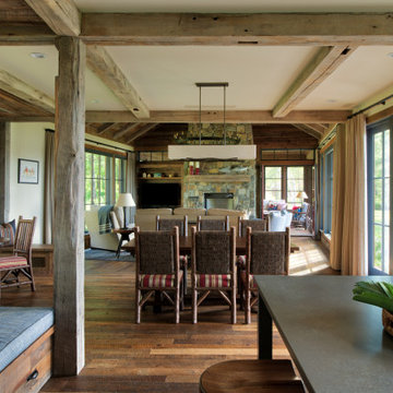 Reclaimed Wood Paneling, Mantel, and Beams in Rustic Great Room Dream Cabin