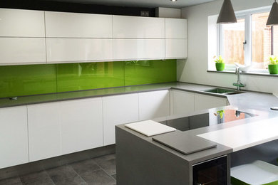 Design ideas for a contemporary open plan kitchen in West Midlands with a peninsula.