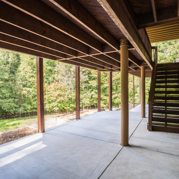Under-Deck Patio with Stair Access and Private Backyard Views