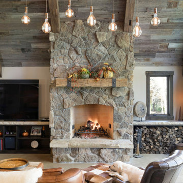 Reclaimed Wood Mantel, Paneling, and Beams in Modern Farmhouse Fireplace Room