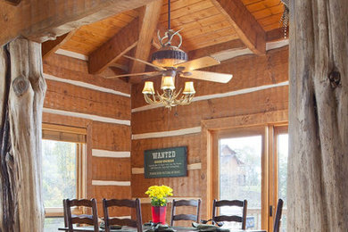 Inspiration for a large rustic light wood floor enclosed dining room remodel in Charlotte