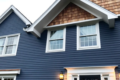 Transitional blue wood exterior home photo in Boston