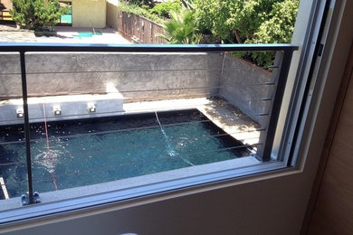 Photo of a mid-sized contemporary backyard deck in San Diego with no cover.