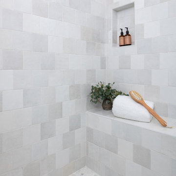 Varying shades of white porcelain square tiles