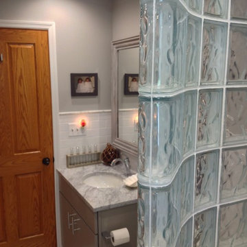 Curved glass block shower wall in a guest bathroom remodel in Columbus Ohio