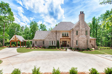 Example of a classic split-level stone exterior home design in Birmingham