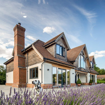 Left Elevation of oak frame house through the lavender