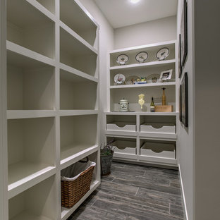Large farmhouse kitchen pantry pictures - Inspiration for a large cottage l-shaped porcelain floor and gray floor kitchen pantry remodel in Omaha with open cabinets, white cabinets and no island