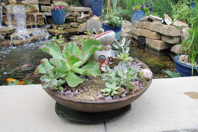 Small eclectic courtyard patio container garden photo in Chicago with no cover