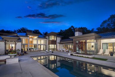 Inspiration for a large contemporary backyard concrete and rectangular lap pool remodel in Salt Lake City