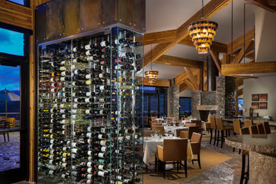 Small mountain style slate floor and gray floor wine cellar photo in Other with display racks