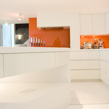 High-gloss white kitchen with Hi-Macs.